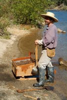 gold miner using a sluice box